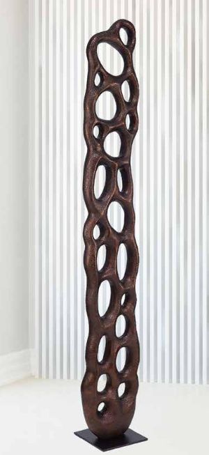Tall carved floor sculpture with pierced openings