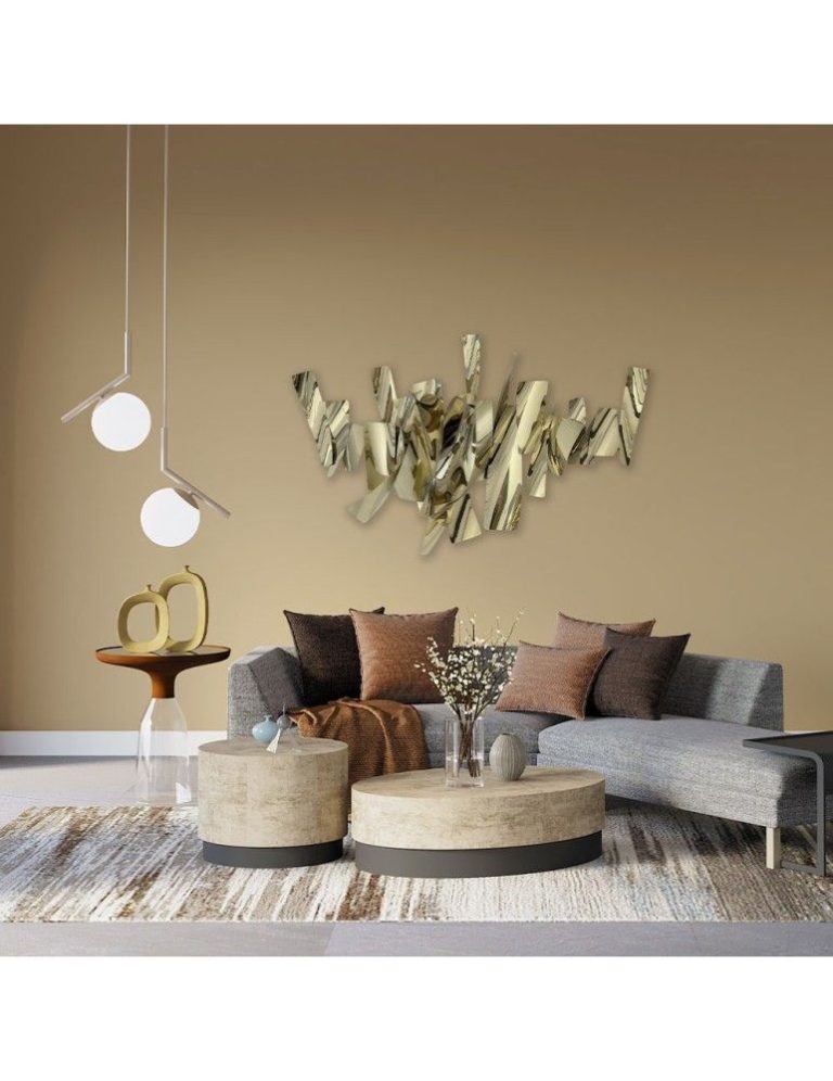 Gold wall sculpture hung above a sofa