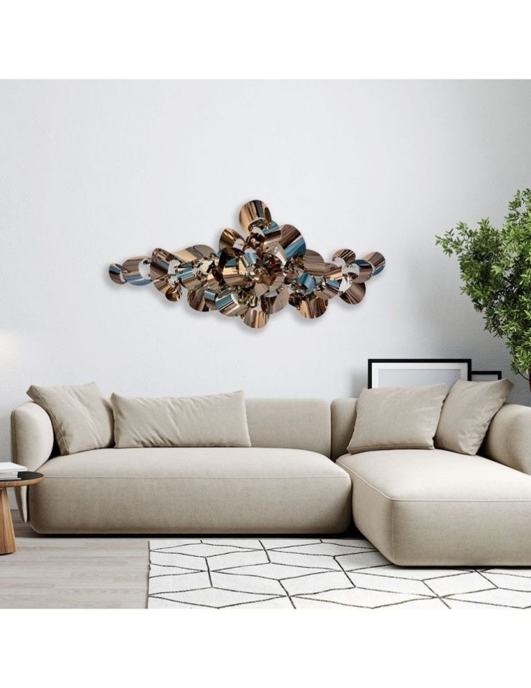 Copper wall sculpture hung above a sofa