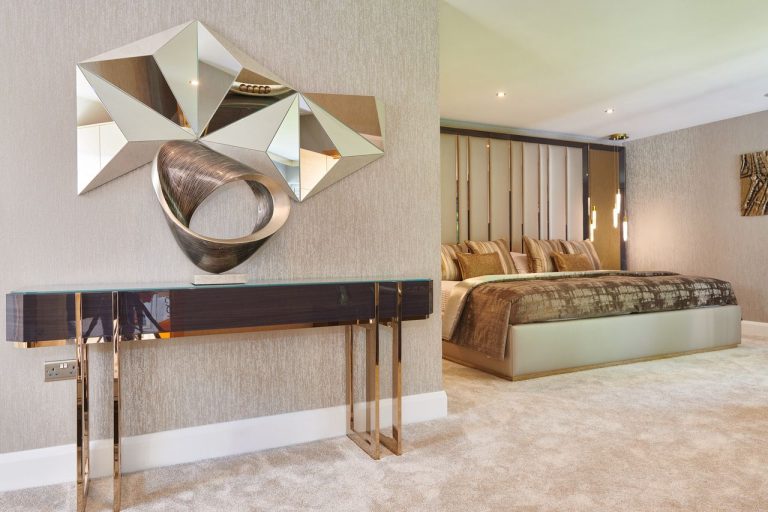 Bedroom with artwork panels above an upholstered headboard