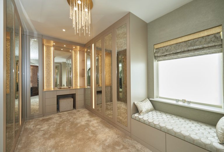 Dressing area built into the same run as the wardrobes
