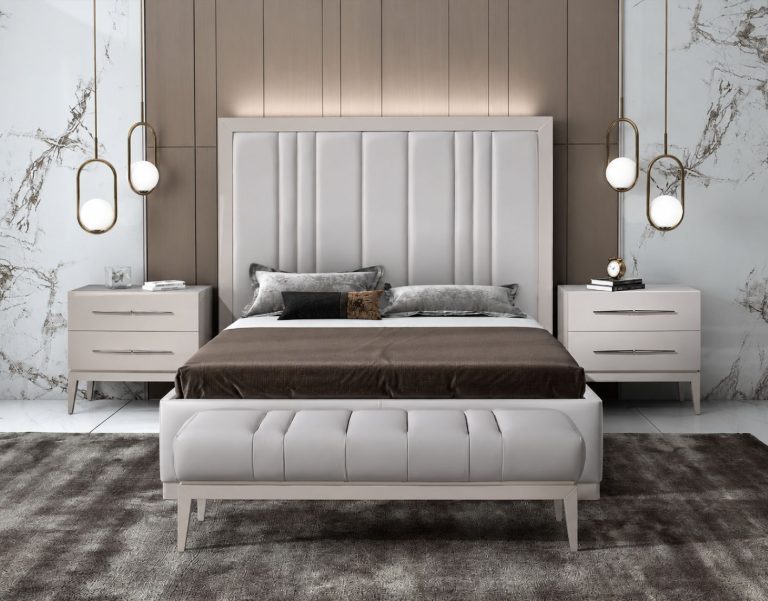Upholstered bed with a panelled headboard and matching bedside chests