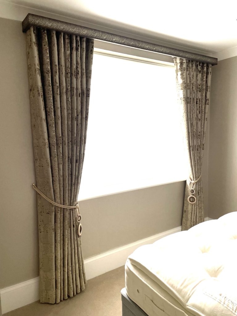 Lined curtain with a tie-back and a sheer beneath