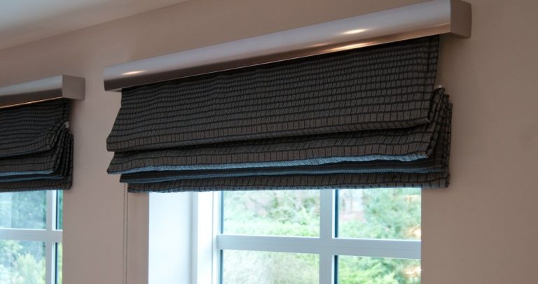 Roman blind in a checked wool, stacked clear of the glass