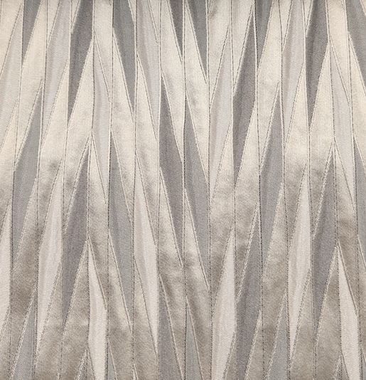 Fabric with a pleated chevron texture in cream and silver