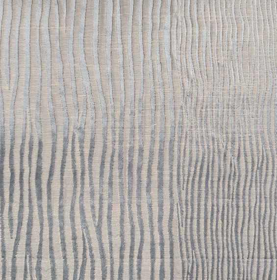 Fabric with a fine vertical stripe in blue and silver