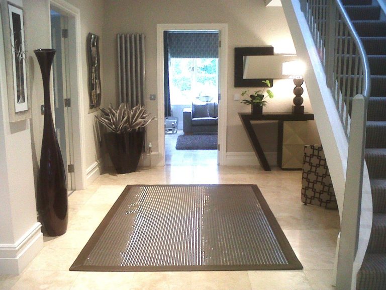 Hall with a console table, mirror and a view through to the sitting room