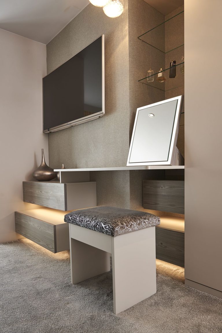 Fitted dressing table with a lit mirror and drawer storage