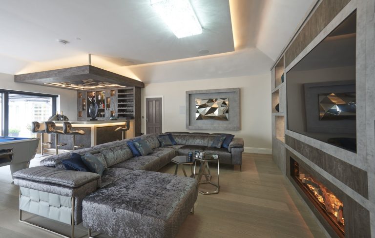 Entertaining space with a bar seating and a media wall
