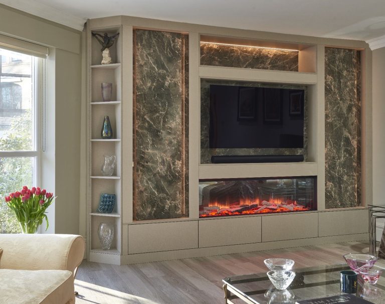 Media wall with a marble surround and a linear fire below the television