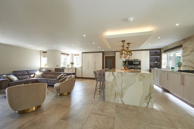 Open-plan living and kitchen space with a marble island