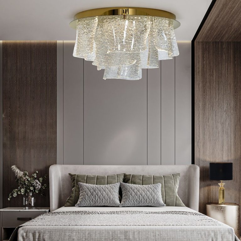 Layered glass ceiling light above a bed