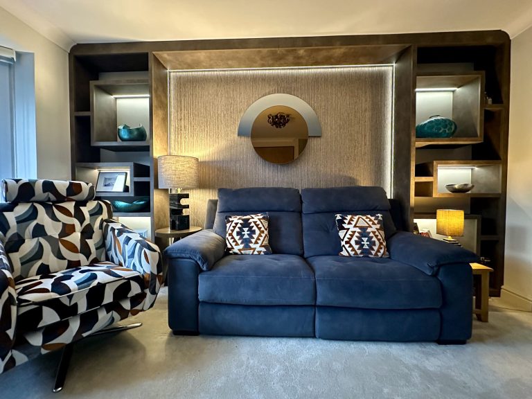 Living room with a navy sofa and bespoke display joinery