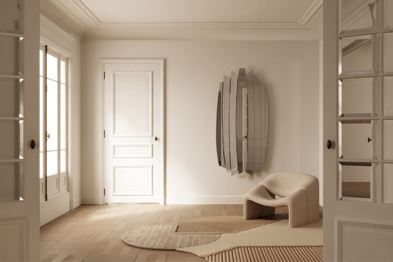 Round wall mirror with a brushed gold surround