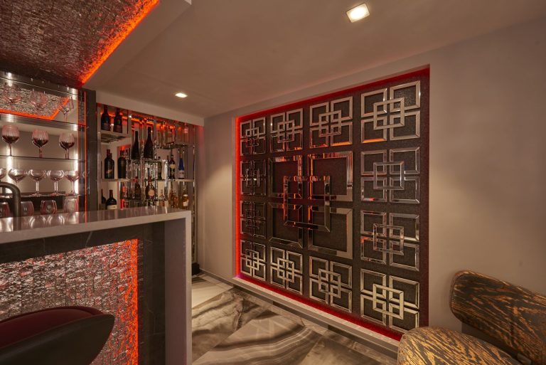 Bar and fretwork screen seen along the basement