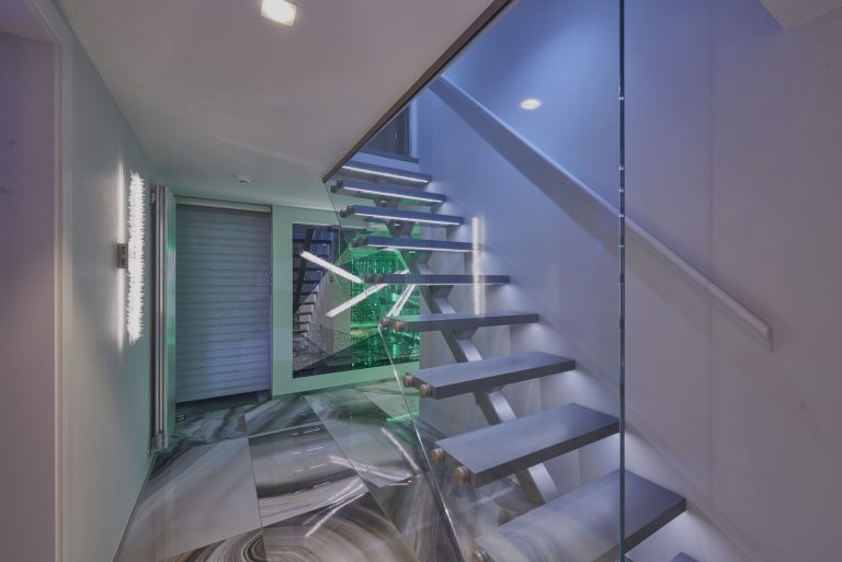 Glass staircase down to the basement