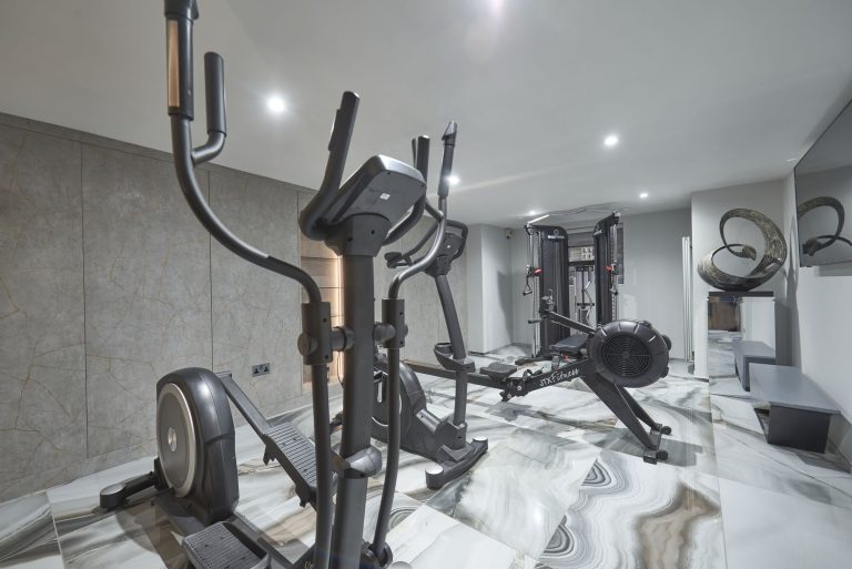 Gym equipment grouped on the marble floor