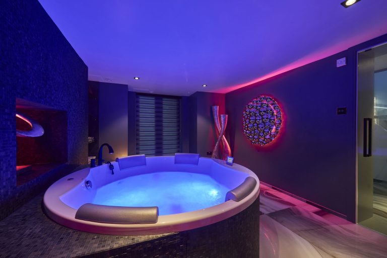 The spa lit pink and purple, another of the lighting settings