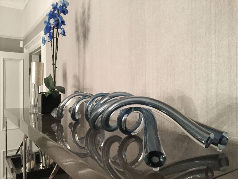 Detail of the silver wave sculpture on the console