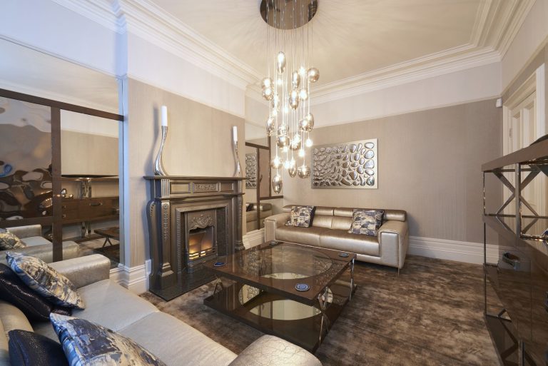 Formal lounge with the silver period fireplace and the mercury glass pendants