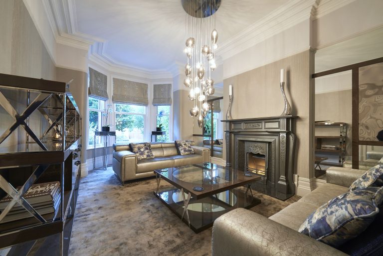 The lounge along its length with the pendant cascade above the table