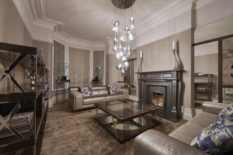 Leather sofas either side of the period fireplace