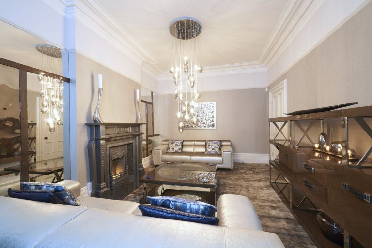 The lounge towards the bay window with the pendants lit