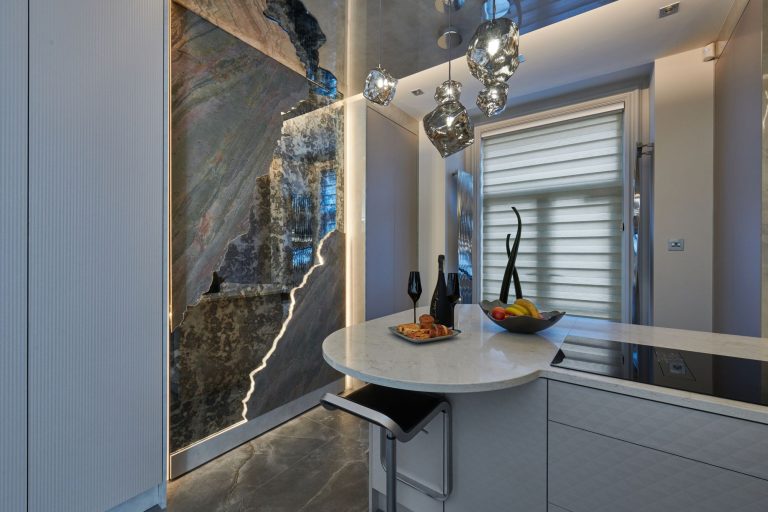 The breakfast bar from the doorway with the stone panel lit