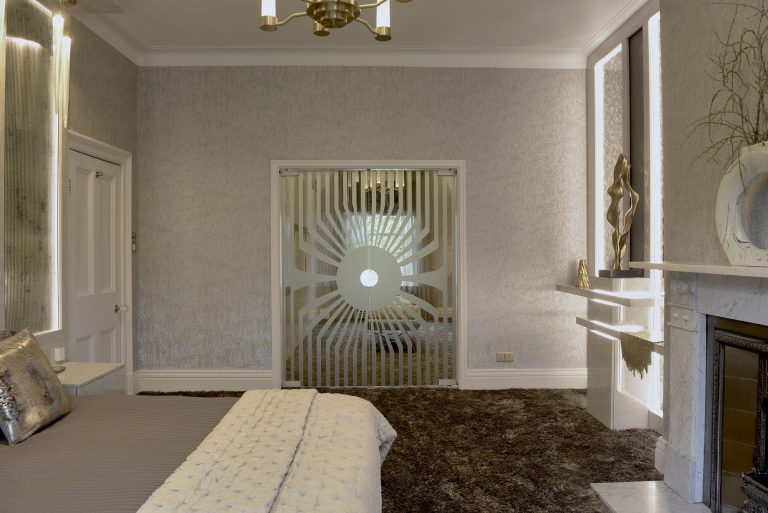 Bronze sand-blasted glass doors through to the dressing room
