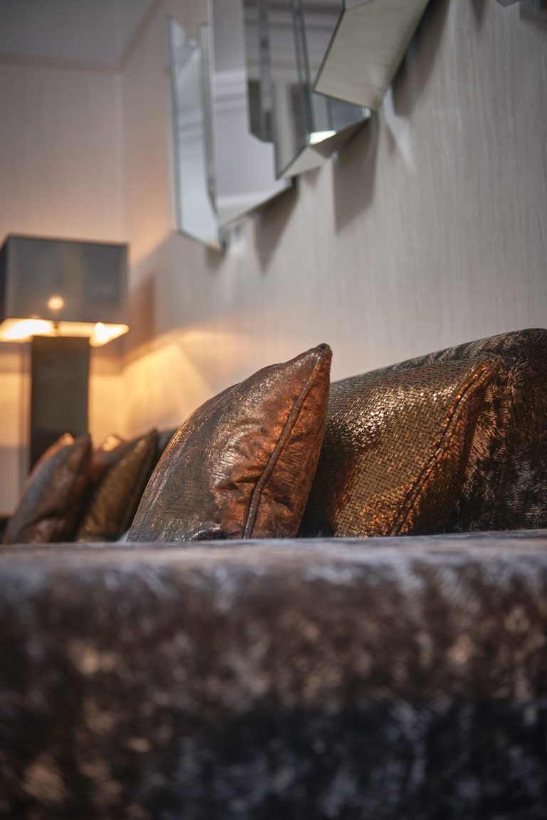 Copper and bronze cushions on crushed velvet