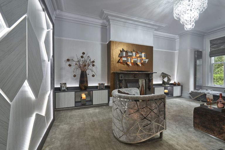 Family lounge with a backlit faceted wall panel and a period fireplace