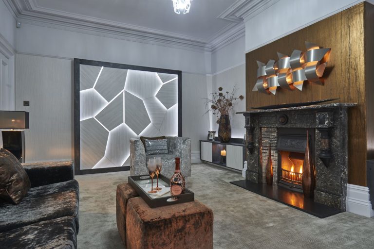 Lounge with velvet ottomans in front of the fire