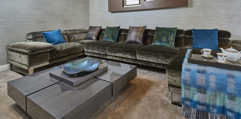 The corner sofa seen from the window end with a low square coffee table