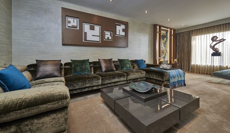 The lounge along its length, sofa, chaise and framed artwork