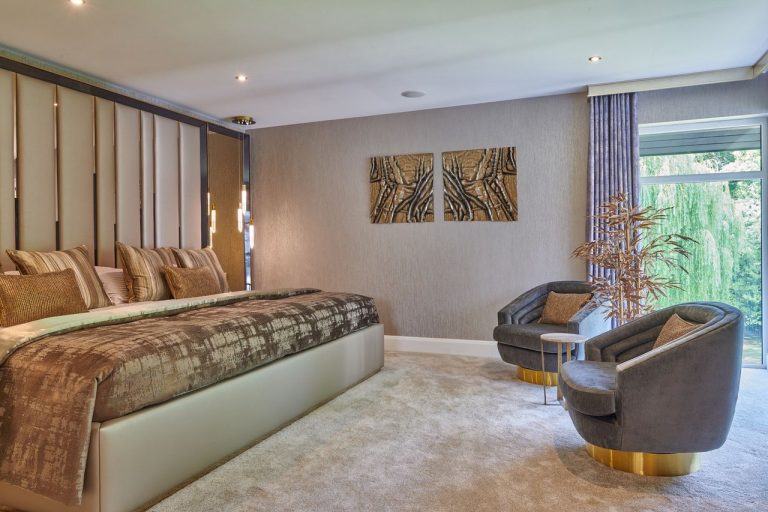 The headboard wall with bronze mirrors and pendant lights