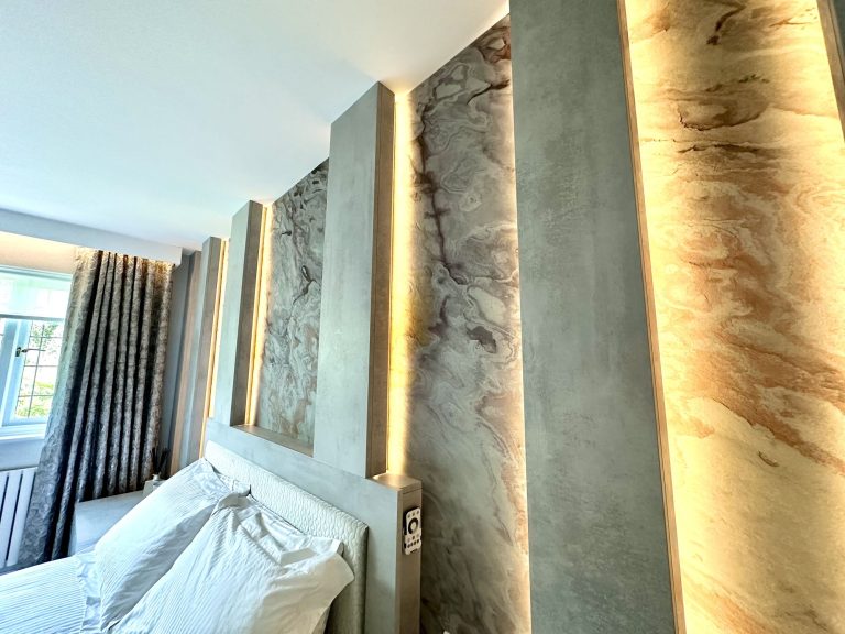 Slate veneer panels lit from within the reveals