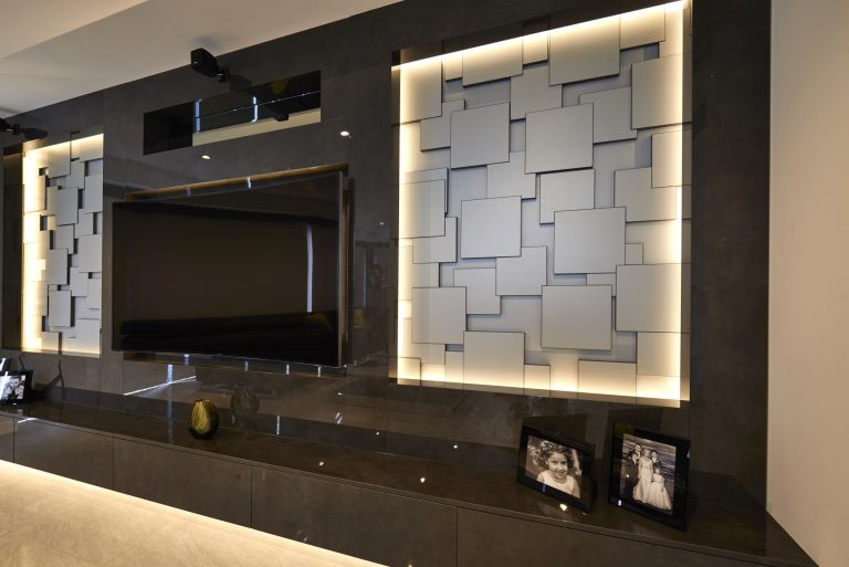 Media wall with backlit three-dimensional tiled panels in a Bowdon new build