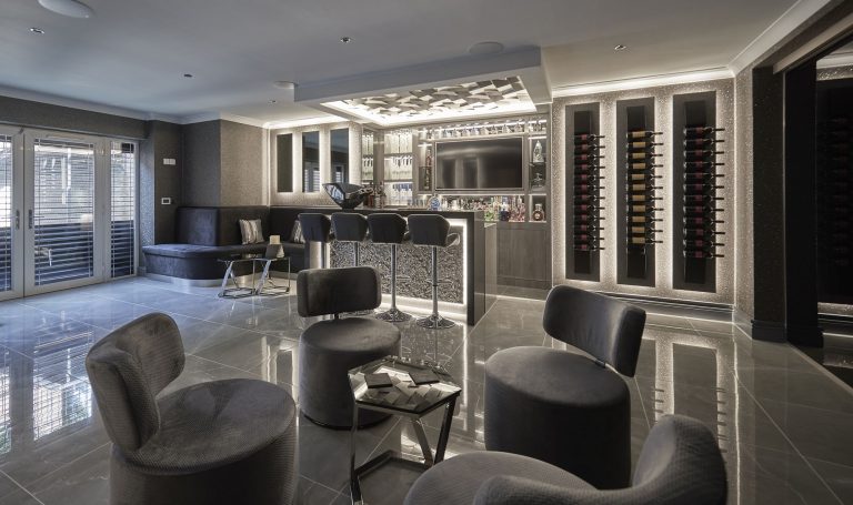 Lounge seating and wine wall in the basement
