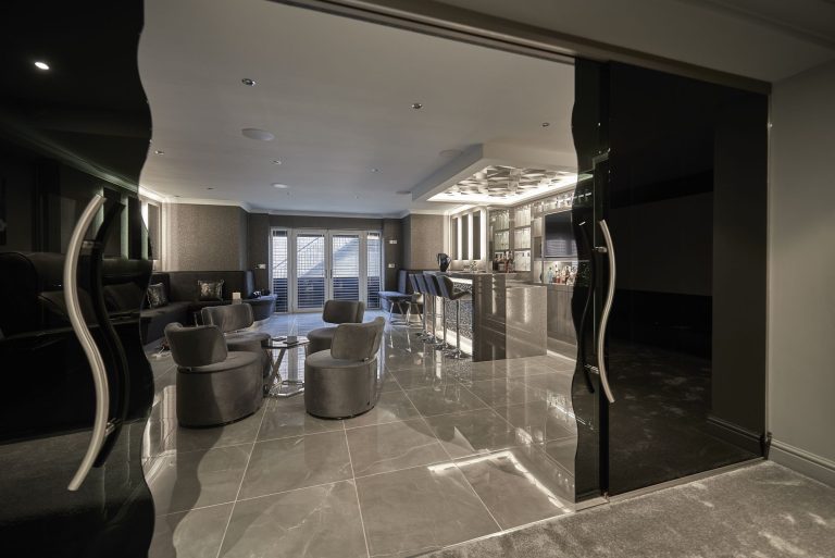 Smoked glass sliding doors between the basement rooms