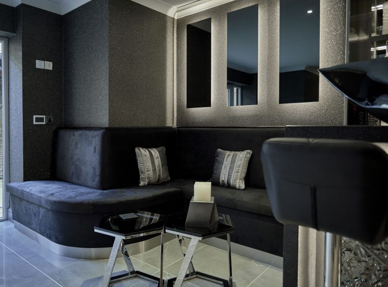 Sparkly mica wall covering in a basement seating area